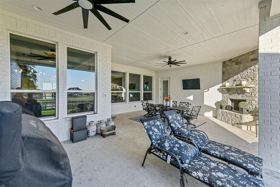 View of patio / terrace with an outdoor stone fireplace