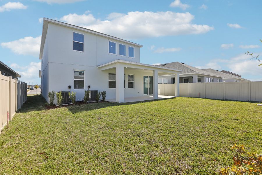 Exterior details and patio area of a home in St. Johns Preserve, Palm Bay (Image 3).