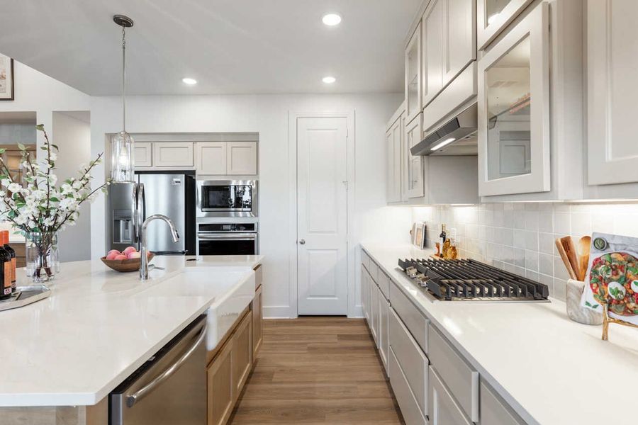 Representative furnished interior of a home built from the Monet-SS by Highland Homes in Lariat, Liberty Hill (Image 10).