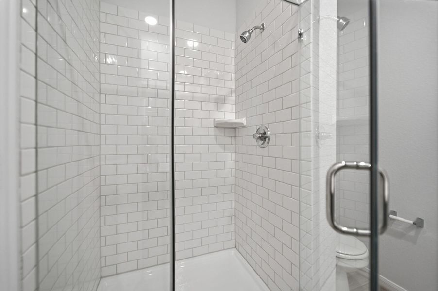 Full bath featuring a stall shower