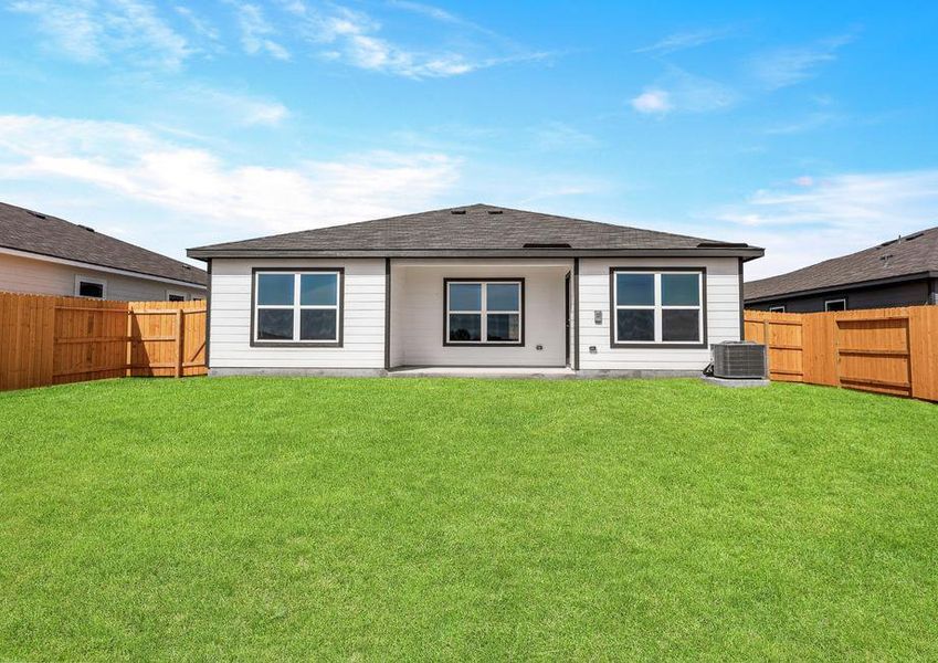 A spacious backyard with a covered patio