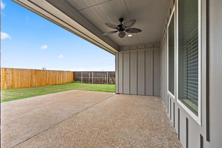 View of patio with ceiling fan and a fenced backyard View of patio with ceiling fan and a fenced backyard