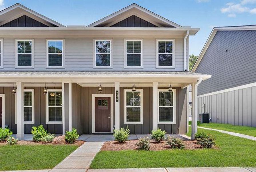 Front exterior of a new home in The Cottages at East Lanier, Fayetteville, GA, highlighting curb appeal (Image 14).