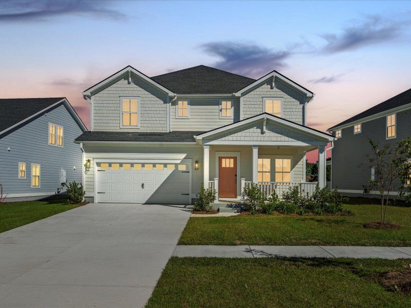 Front exterior of a new home in The Coves at Lakes of Cane Bay, Summerville, SC, highlighting curb appeal (Image 21).