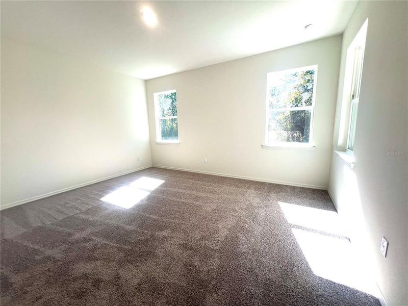 Spacious, unfurnished interior of a new home in Palm Coast: Cornerstone Collection, Palm Coast (Image 17).