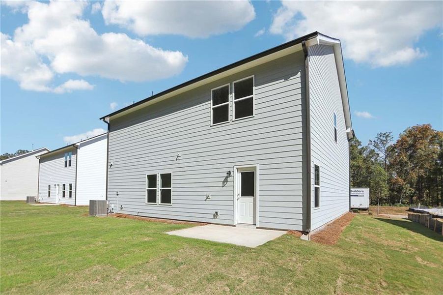 Exterior details and patio area of a home in The Pointe at Heron Bay, Locust Grove (Image 3).