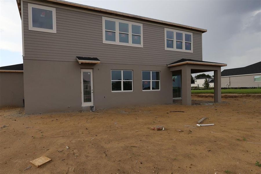 Exterior details and patio area of a home in Wolf Lake Ranch, Apopka (Image 3).