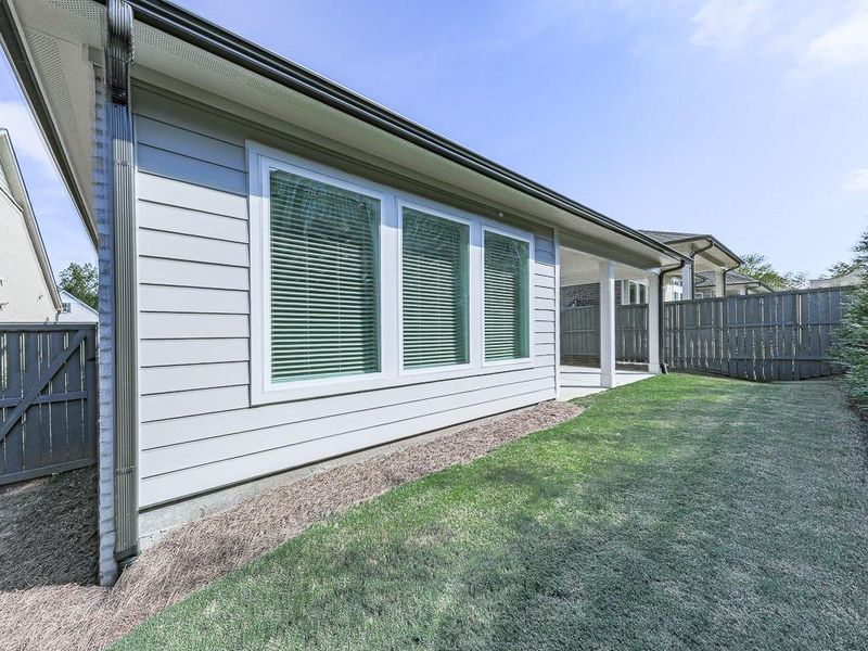 Exterior details and patio area of a home in Glenhaven at Ridgewalk, Woodstock (Image 34).