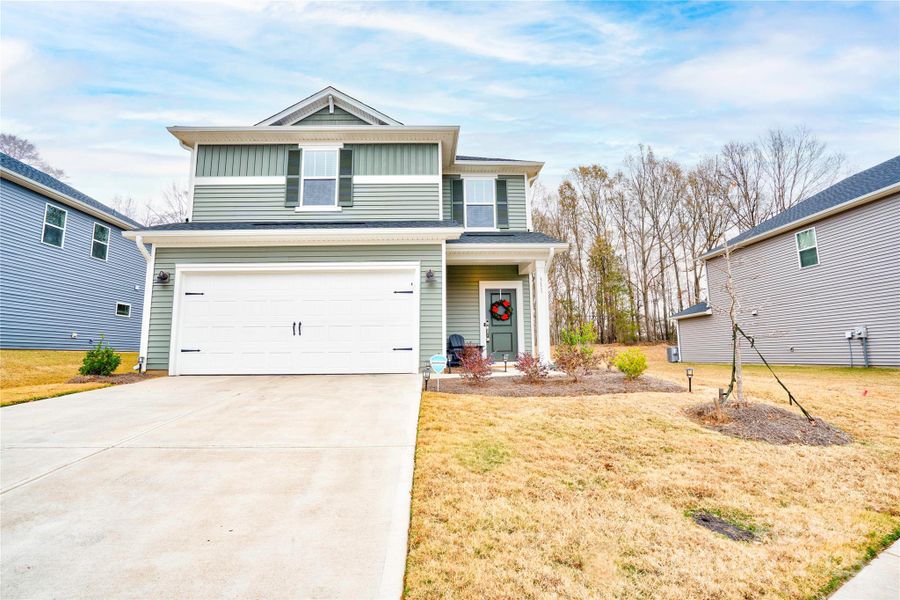 Front exterior of a new home in , Shelby, NC, highlighting curb appeal (Image 1).