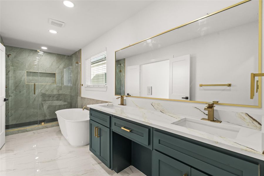 Spa-day luxury, every single day. The primary ensuite boasts an expansive double vanity, an ultra-modern standalone soaking tub, and a massive glass-enclosed shower.