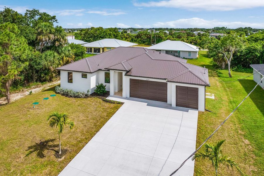 Front exterior of a new home in , Labelle, FL, highlighting curb appeal (Image 2). Front exterior of a new home in , Labelle, FL, highlighting curb appeal (Image 2).
