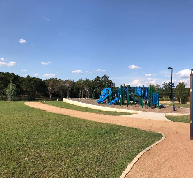 Community playground featuring a lawn