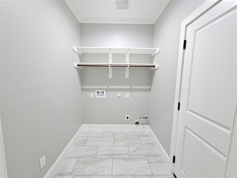 This is the Laundry room and has access to the garage! It has plenty of space for storage or to decorate as you like.