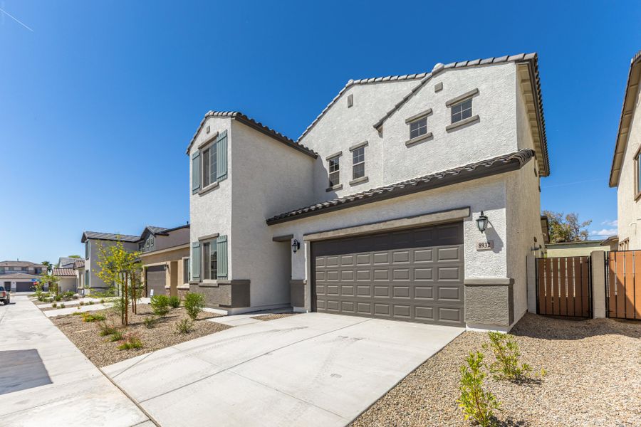 Front exterior of a new home in Rialta, Mesa, AZ, highlighting curb appeal (Image 1). Front exterior of a new home in Rialta, Mesa, AZ, highlighting curb appeal (Image 1).