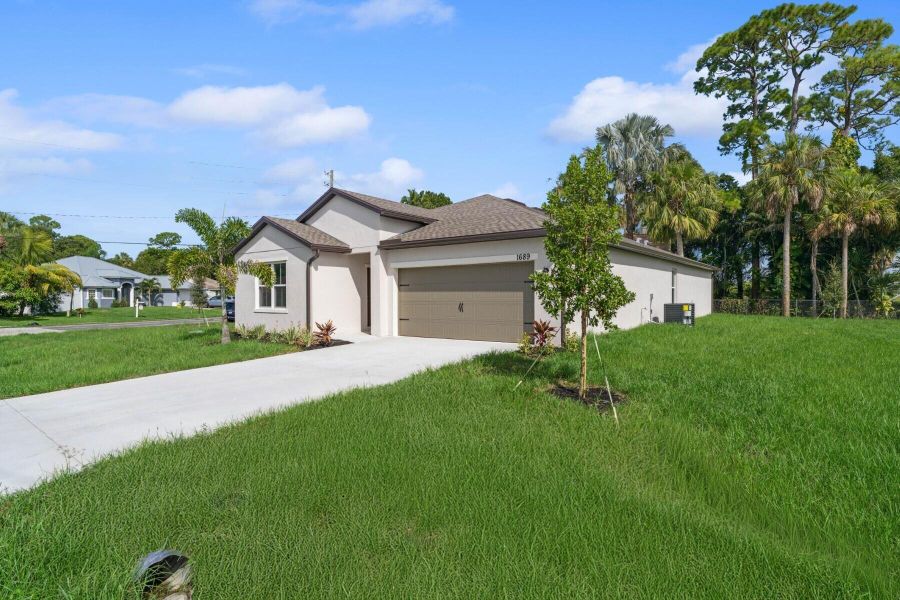 Front exterior of a new home in , Port St. Lucie, FL, highlighting curb appeal (Image 22). Front exterior of a new home in , Port St. Lucie, FL, highlighting curb appeal (Image 22).
