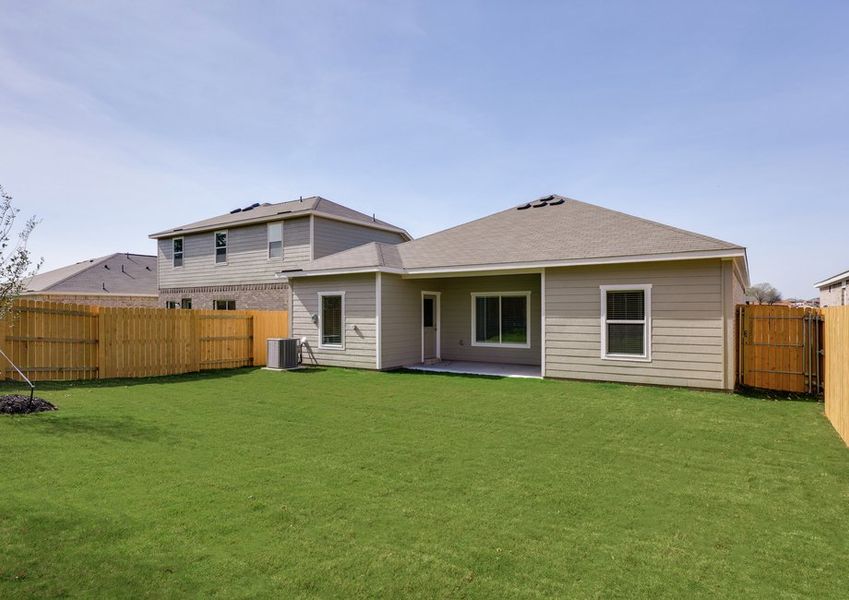The back yard is fully fenced in.