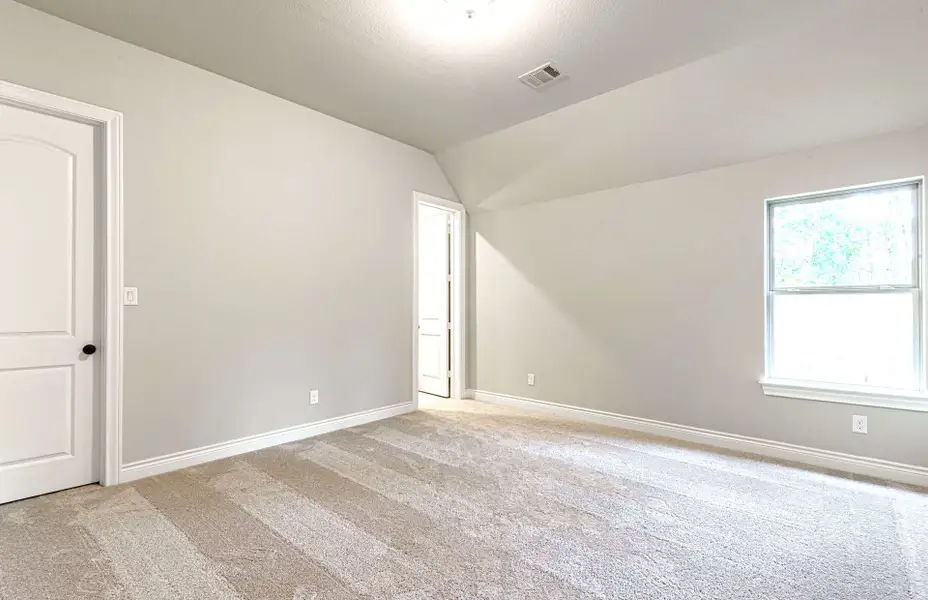 Representative unfurnished interior of a home built from the 3616 by Ravenna Homes in Artavia 70′, Conroe (Image 52).