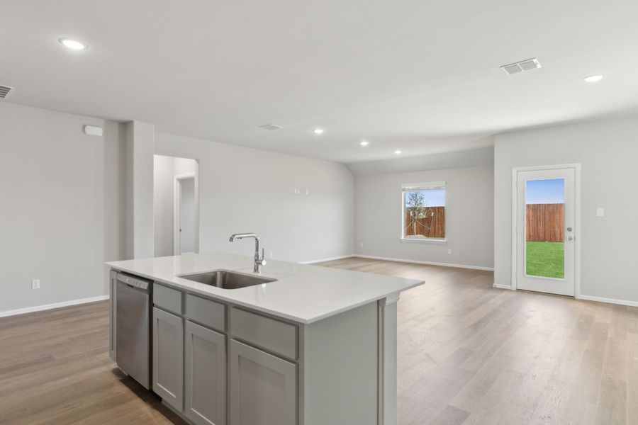 Kitchen in the Harrison home plan by Trophy Signature Homes – REPRESENTATIVE PHOTO