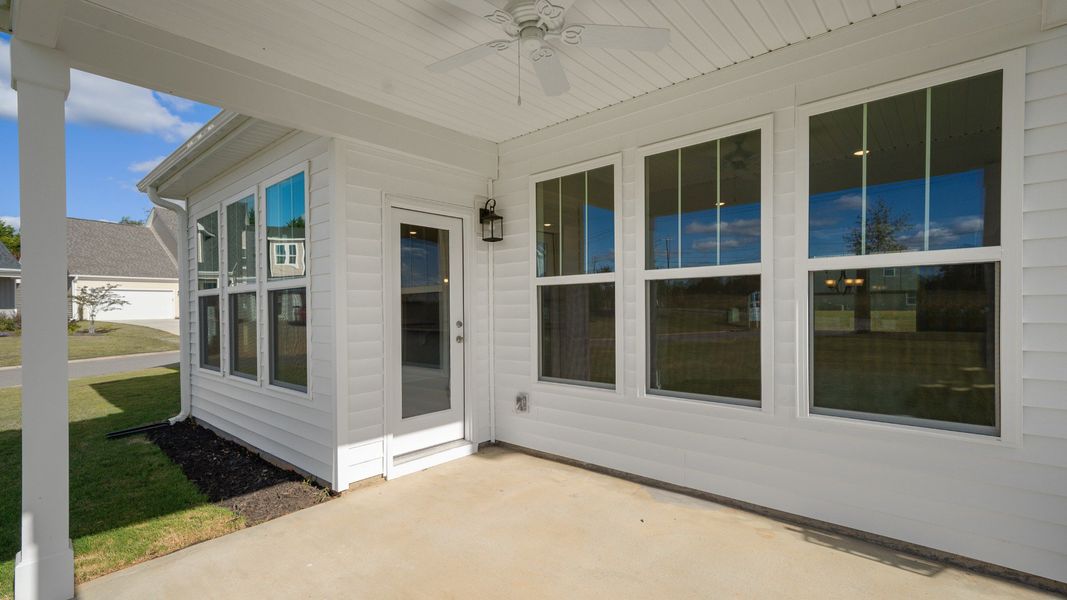 2 story single family home, all white with a 2 car garage