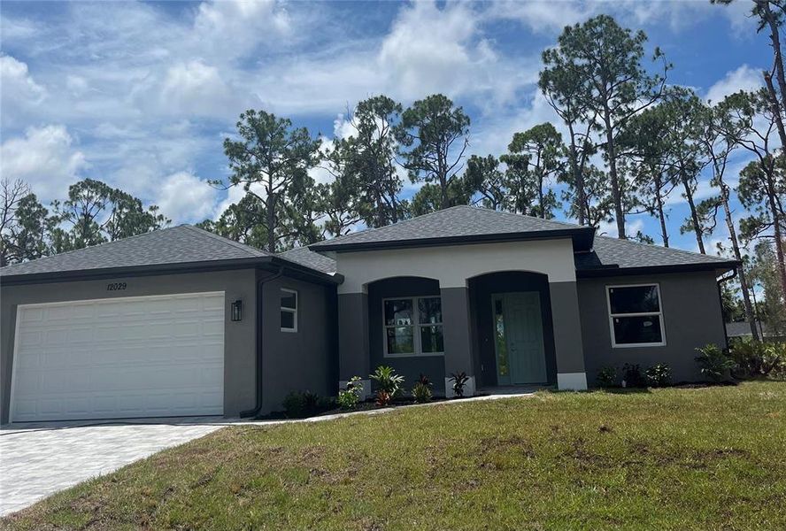 Front exterior of a new home in , Port Charlotte, FL, highlighting curb appeal (Image 17). Front exterior of a new home in , Port Charlotte, FL, highlighting curb appeal (Image 17).