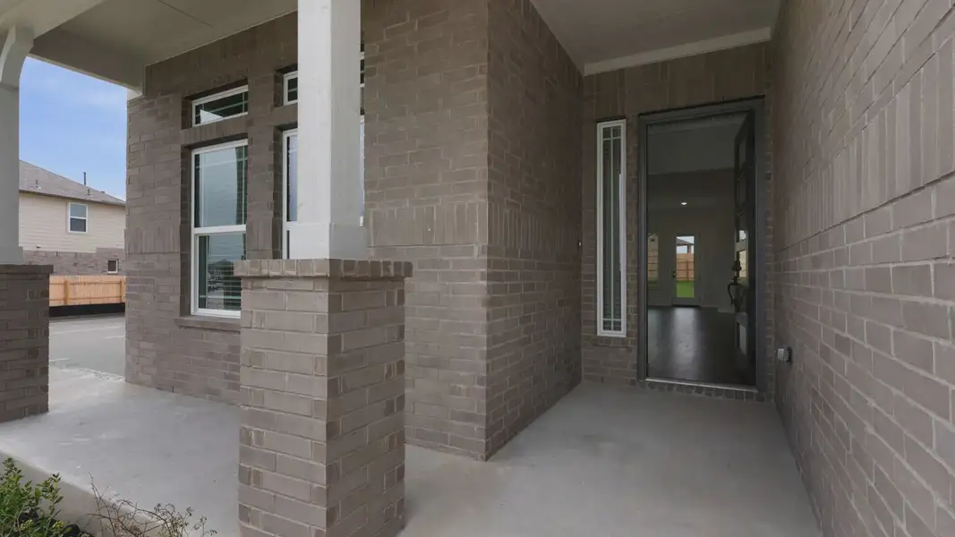 Exterior details and patio area of a home in The Grove at Blackhawk, Pflugerville (Image 2). Exterior details and patio area of a home in The Grove at Blackhawk, Pflugerville (Image 2).