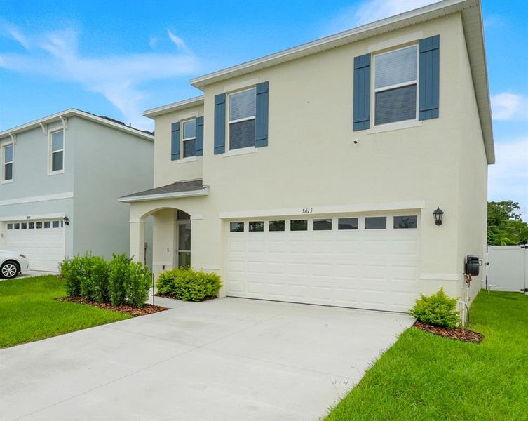 Front exterior of a new home in Avalon Park Tavares, Tavares, FL, highlighting curb appeal (Image 28). Front exterior of a new home in Avalon Park Tavares, Tavares, FL, highlighting curb appeal (Image 28).
