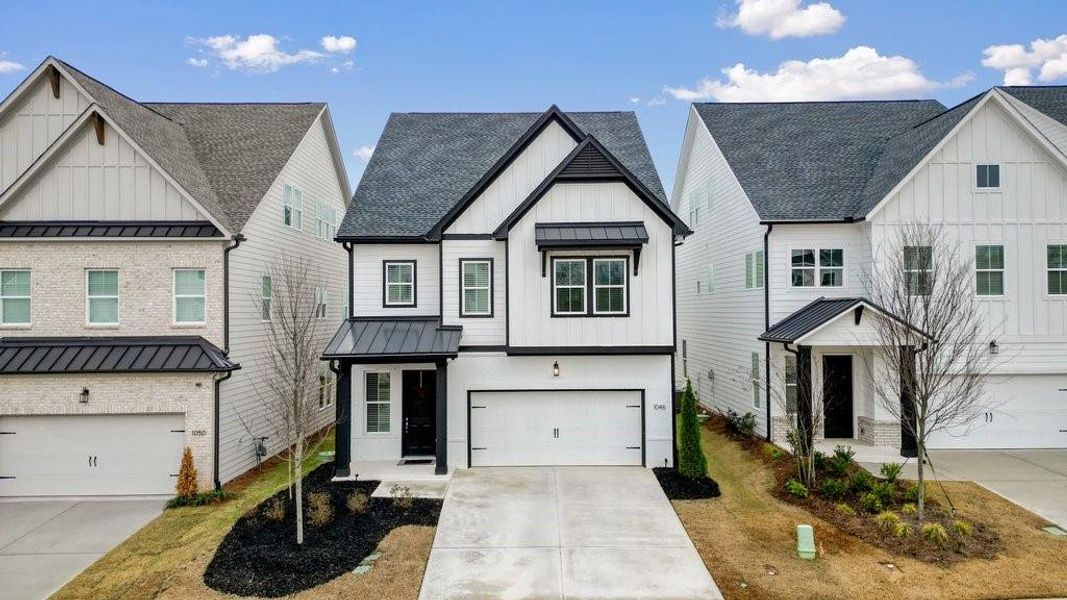 Front exterior of a new home in , Canton, GA, highlighting curb appeal (Image 2). Front exterior of a new home in , Canton, GA, highlighting curb appeal (Image 2).