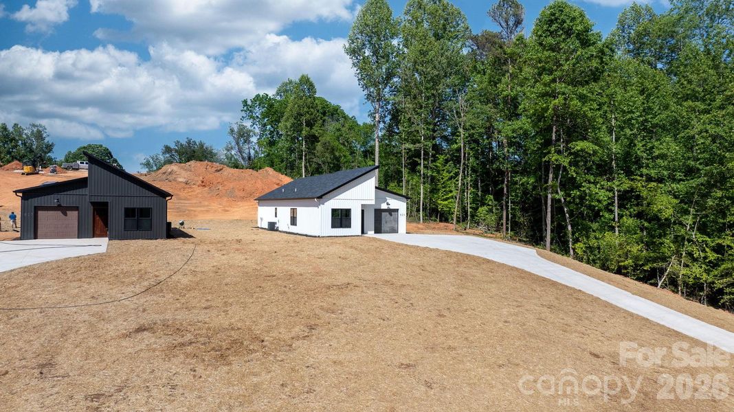 Front exterior of a new home in , Lenoir, NC, highlighting curb appeal (Image 18).