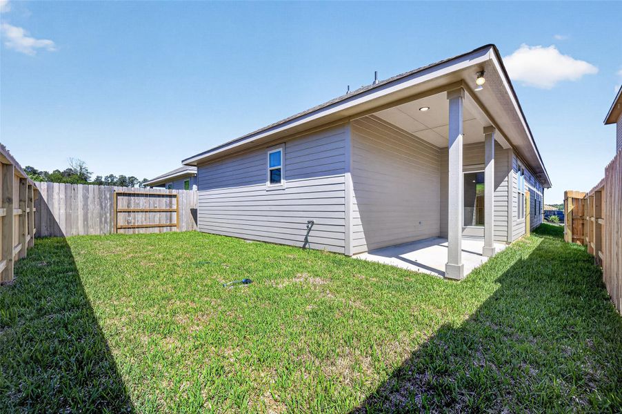 Exterior details and patio area of a home in Mostyn Springs, Magnolia (Image 24).