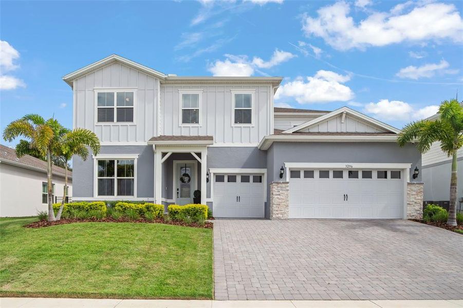 Front exterior of a new home in , Winter Garden, FL, highlighting curb appeal (Image 20). Front exterior of a new home in , Winter Garden, FL, highlighting curb appeal (Image 20).