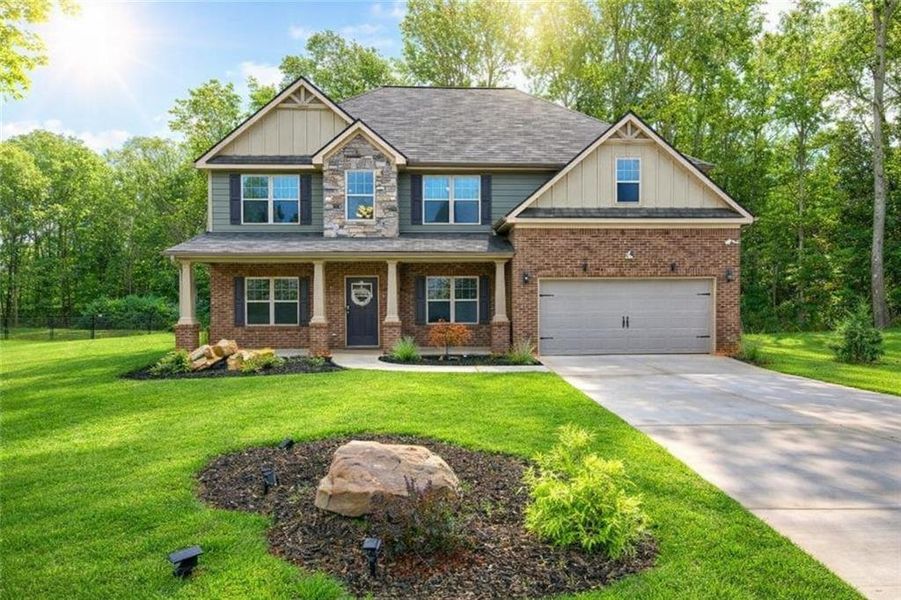 Front exterior of a new home in Nine Oaks, Locust Grove, GA, highlighting curb appeal (Image 28).