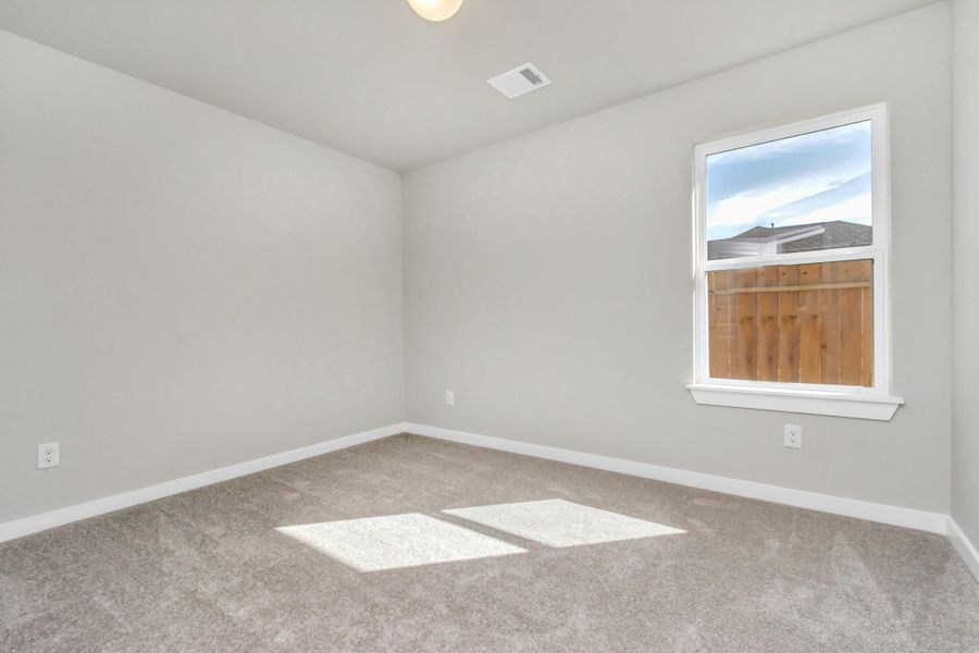 Generously sized secondary bedrooms featuring spacious closets, soft and inviting carpeting underfoot, large windows allowing plenty of natural light, and the added touch of privacy blinds for your personal retreat. Sample photo of completed plan. As-built color and selections may vary. Generously sized secondary bedrooms featuring spacious closets, soft and inviting carpeting underfoot, large windows allowing plenty of natural light, and the added touch of privacy blinds for your personal retreat. Sample photo of completed plan. As-built color and selections may vary.