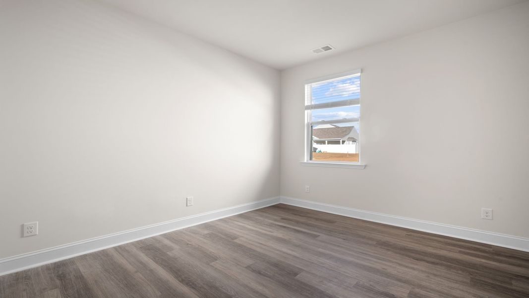 Spacious, unfurnished interior of a new home in The Groves at Bees Creek, Ridgeland (Image 21).