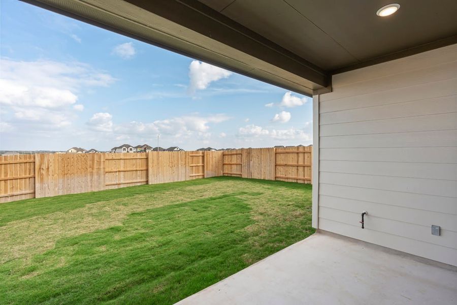 Exterior details and patio area of a home in Terrace Collection at Lariat, Liberty Hill (Image 29).