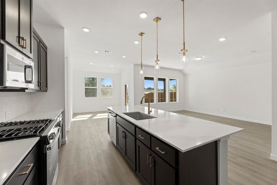 Open Kitchen-Living-Dining Room featuring the Oxford Collection