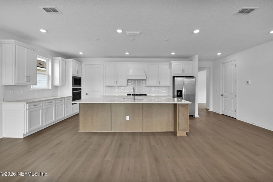 Furnished interior view inside a new home in Summer Bay at Grand Oaks, St. Augustine (Image 12).