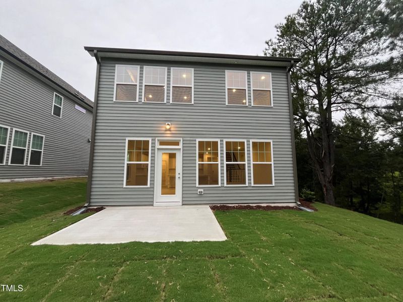 Back of home with large private patio