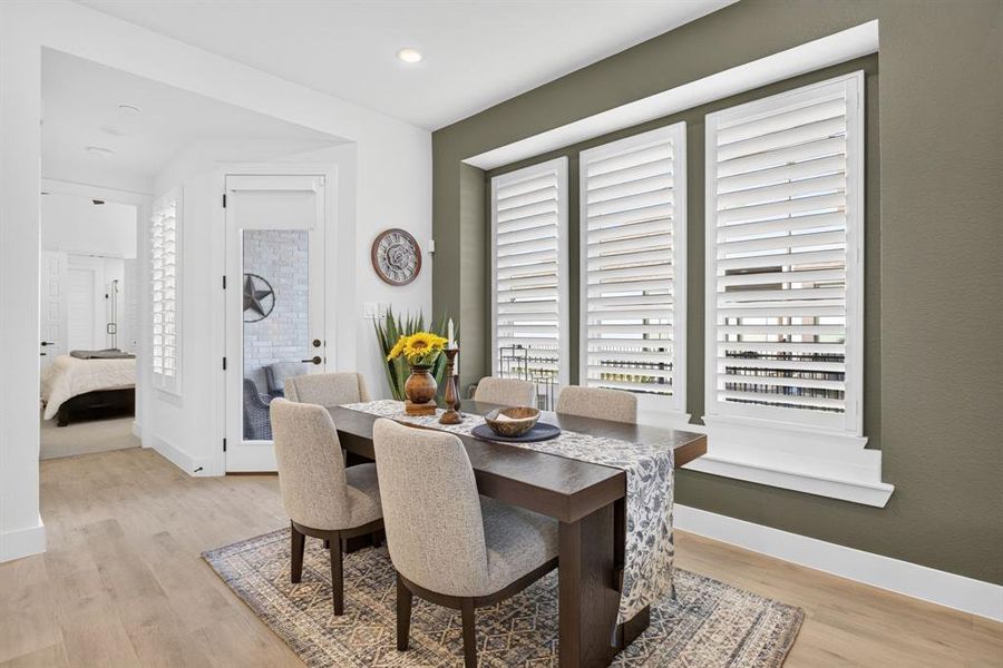Dining space is GENEROUS with a wide ledge windowsill for decor. Hallway leads past a half bathroom to the primary. Little side porch past the glass door. Dining space is GENEROUS with a wide ledge windowsill for decor. Hallway leads past a half bathroom to the primary. Little side porch past the glass door.
