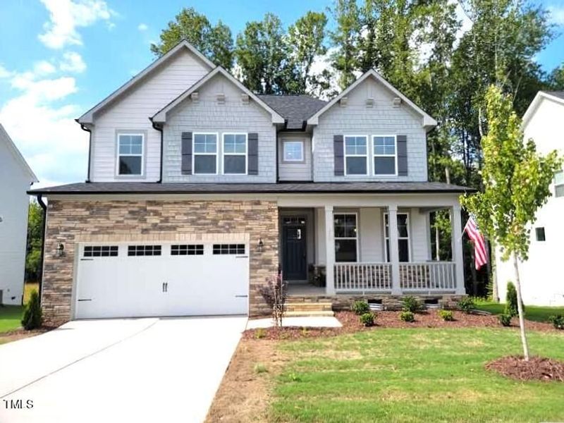 Front exterior of a new home in Stagecoach Corner, Mebane, NC, highlighting curb appeal (Image 58). Front exterior of a new home in Stagecoach Corner, Mebane, NC, highlighting curb appeal (Image 58).
