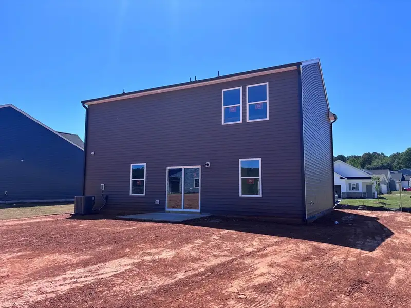 Exterior details and patio area of a home in Middleton Farms, Middlesex (Image 4).