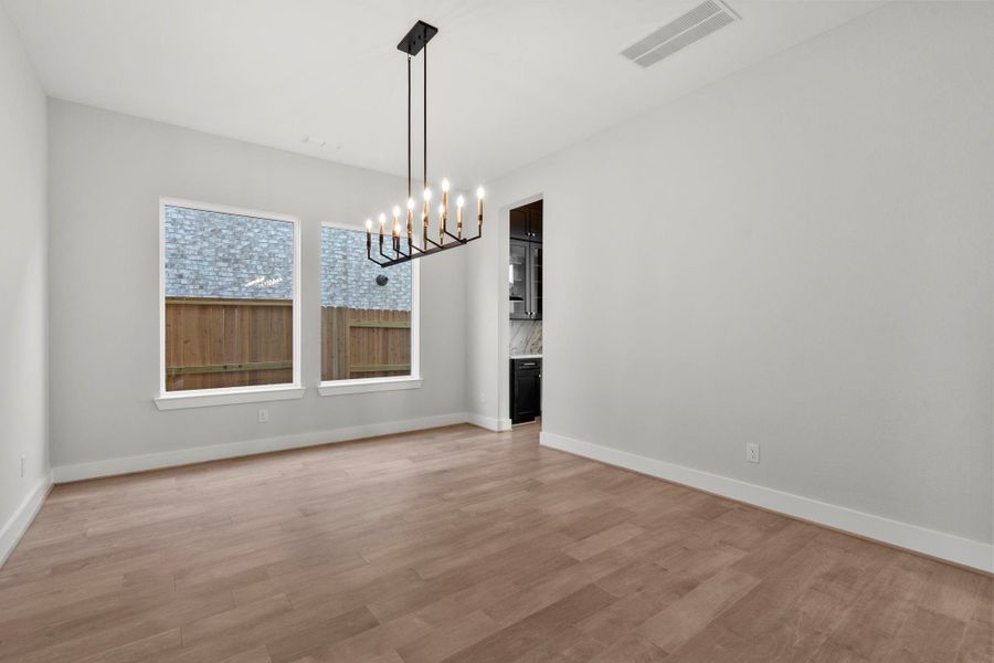 The formal dining area is connected to the kitchen through the butlers pantry.