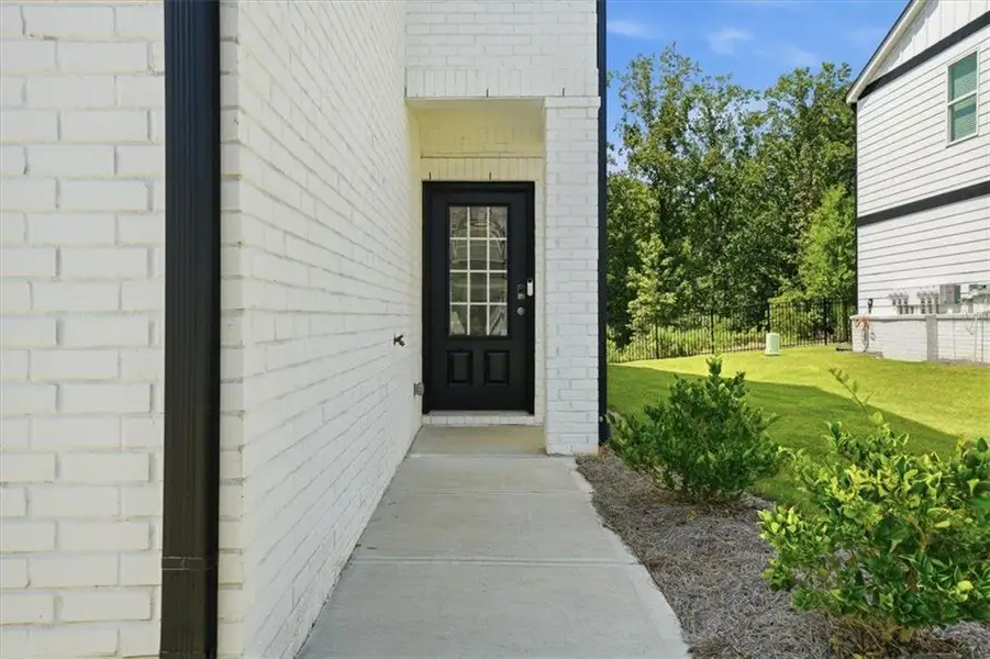 Exterior details and patio area of a home in Brooks at Riverview Landing, Smyrna (Image 4).