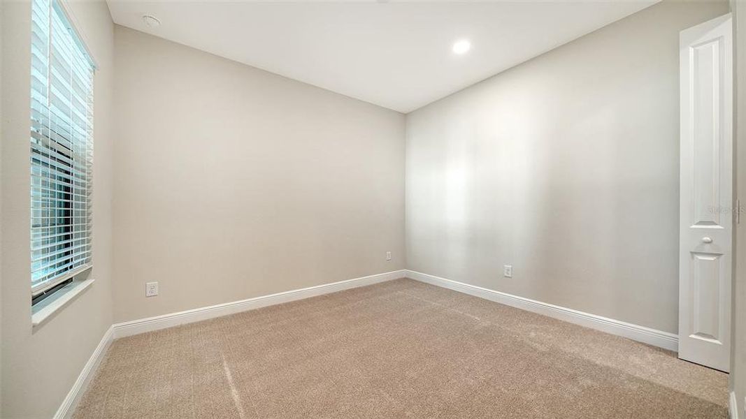Spacious, unfurnished interior of a new home in Vicenza Real Estate and Homes for Sale in North Venice, FL - Neal Communities, Nokomis (Image 26).
