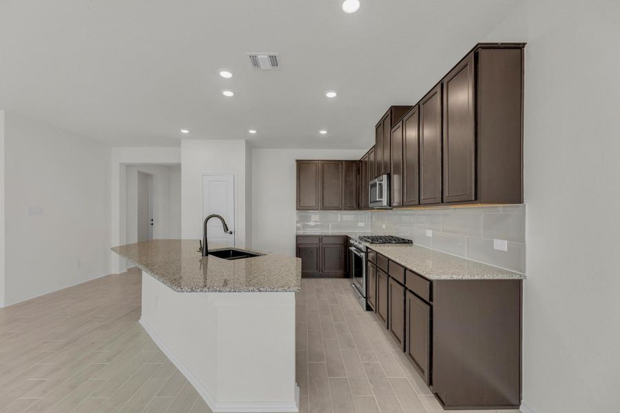 Furnished interior view inside a new home in Salerno - Classic Collection, Round Rock (Image 7). Furnished interior view inside a new home in Salerno - Classic Collection, Round Rock (Image 7).