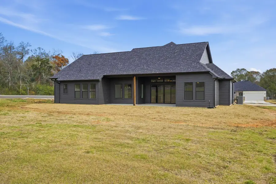 Exterior details and patio area of a home in , New Waverly (Image 4).