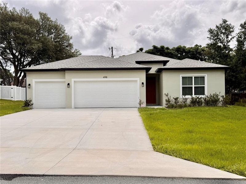 Front exterior of a new home in , Ocala, FL, highlighting curb appeal (Image 2). Front exterior of a new home in , Ocala, FL, highlighting curb appeal (Image 2).