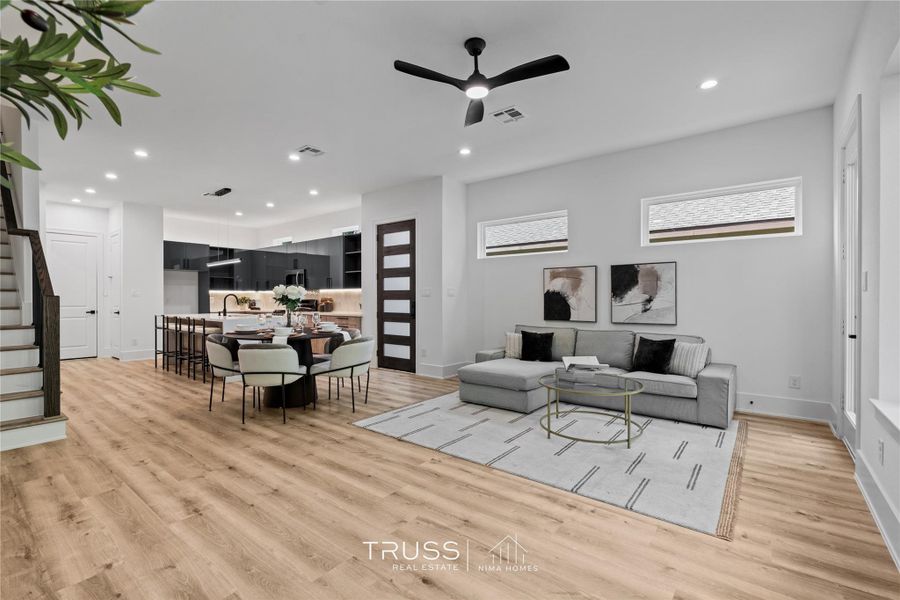 A perfect illustration of modern living, where cooking, dining, and lounging converge effortlessly in this free-flowing open plan.