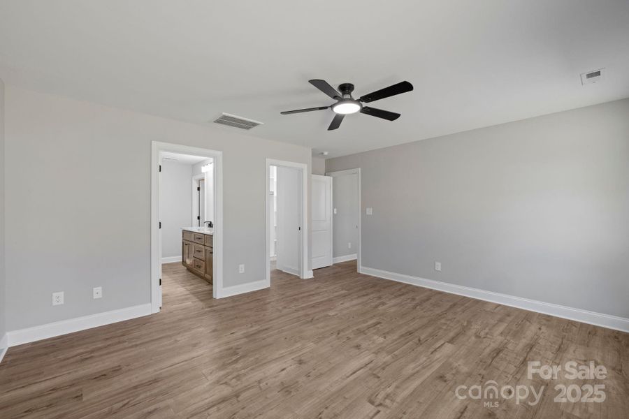 Primary bedroom is privately located on the left wing of the home, separated from the additional bedrooms for added comfort and quiet. Primary bedroom is privately located on the left wing of the home, separated from the additional bedrooms for added comfort and quiet.