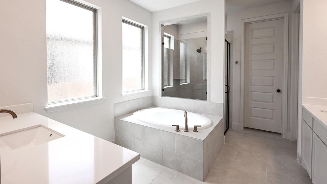 Furnished interior view inside a new home in 6 Creeks, Kyle (Image 8).