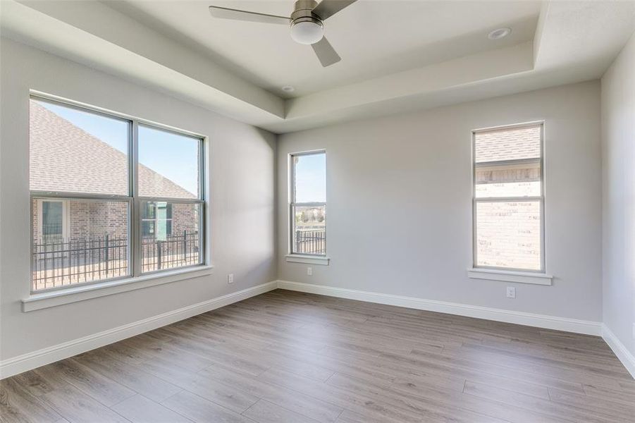 The primary bedroom has can lights as well as a ceiling fan. The primary bedroom has can lights as well as a ceiling fan.